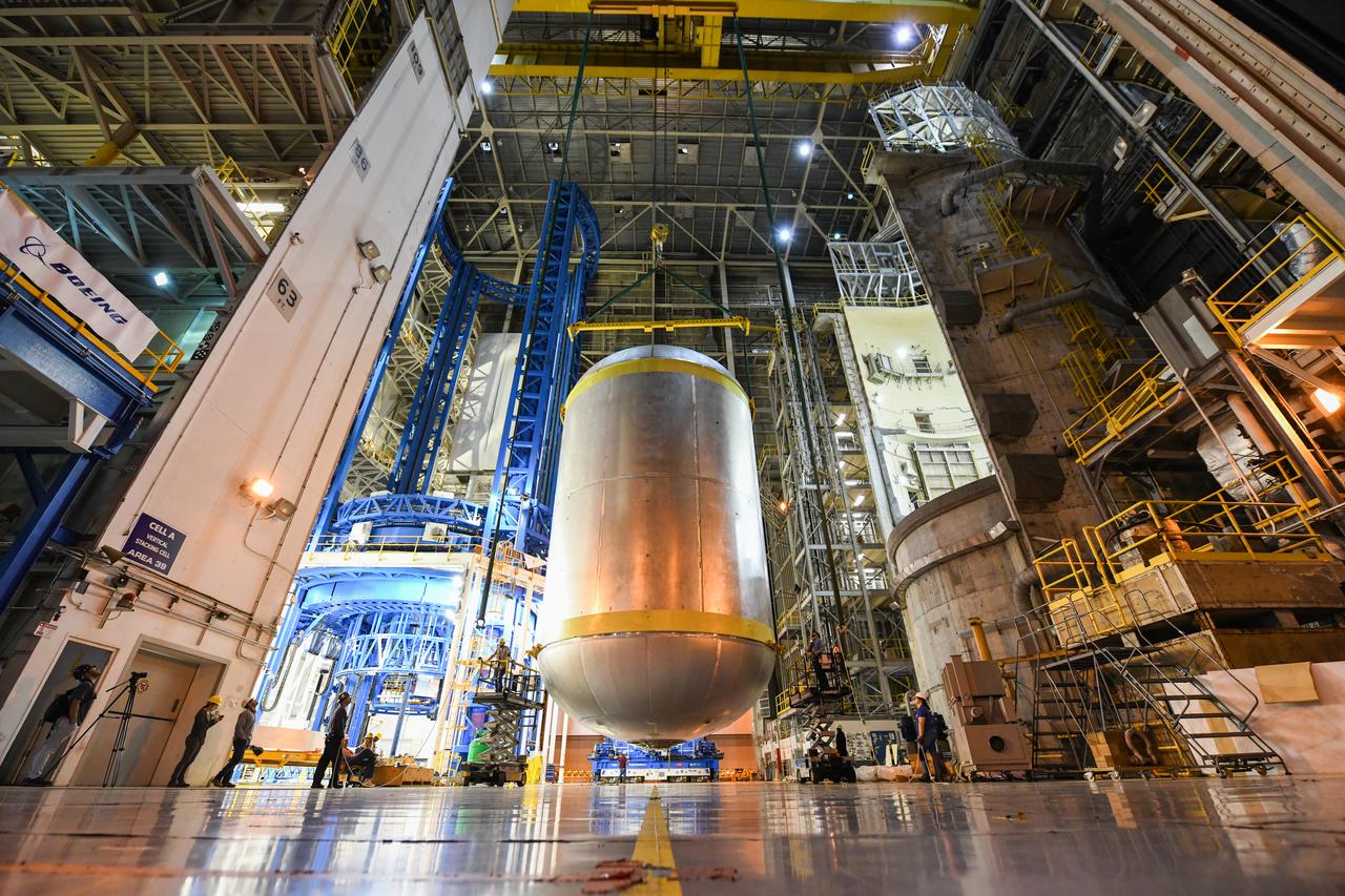 This image shows the latest progress NASA has made in manufacturing the liquid oxygen tank for the second core stage of NASA’s Space Launch System (SLS) rocket. The liquid oxygen tank will be used for the first crewed mission, Artemis II, of the agency’s Artemis program. Teams at NASA’s Michoud Assembly Facility in New Orleans recently completed internal cleaning of the liquid oxygen, or LOX, tank at the facility. Following the cleaning, crews prepared the propellant tank for the next phase of phase of assembly in a different area of the factory by moving, or breaking over, the tank from a vertical to horizontal position. The LOX tank is one of five major elements that make up the rocket’s massive 212-foot-tall core stage. The propellant tank holds 196,000 gallons of supercooled liquid oxygen to help fuel four RS-25 engines, and the internal cleaning ensures no contaminants make their way into the complex propulsion and engine systems of the deep space rocket. The stage, which includes a cluster of four RS-25, will produce more than 2 million pounds of thrust to help launch the SLS rocket and astronauts aboard NASA’s Orion spacecraft around the Moon for Artemis II. NASA is working to land the first woman and the next man on the Moon by 2024. The agency’s SLS rocket offers more payload mass, volume capability and energy to speed missions through deep space and enable NASA’s Artemis lunar program. SLS, along with Orion, the human landing system, and the Gateway in orbit around the Moon are NASA’s backbone for deep space exploration. No other rocket is capable of carrying astronauts in Orion around the Moon in a single mission.